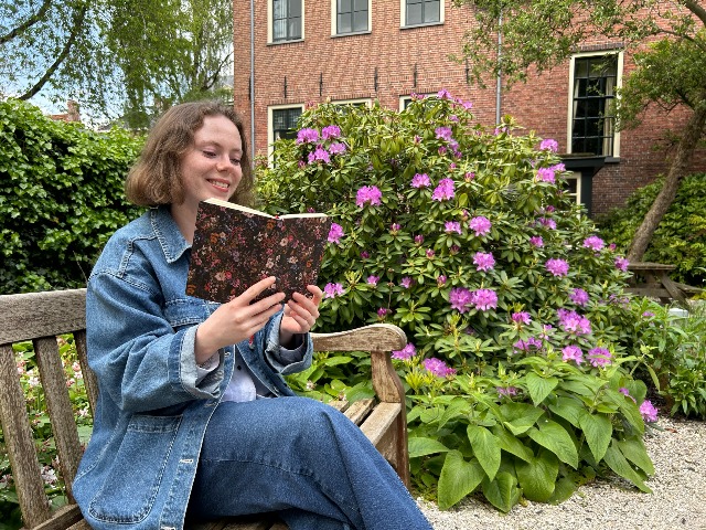 Hylke studying outside to soak up the sun.