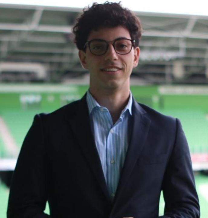 Enrico Portella wearing a professional suit at a stadium profile picture